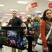 Target Shopper Scott Kemps carries a television in the check out line on Thursday. Daniel Brenner I AnnArbor.com